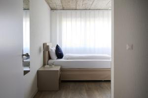 Postel nebo postele na pokoji v ubytování Aabach Hotel