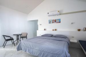 Voodi või voodid majutusasutuse Corsita Resort Koh Mak toas