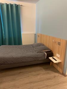 Postel nebo postele na pokoji v ubytování Le grand cerf