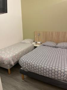 Postel nebo postele na pokoji v ubytování Le grand cerf