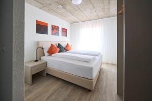 Postel nebo postele na pokoji v ubytování Aabach Hotel