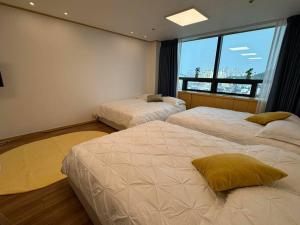 Letto o letti in una camera di Hongdae sub 1min