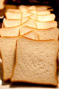 a group ofasted bread sandwiches on a plate at Citadines Central Shinjuku Tokyo in Tokyo