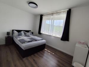 Postel nebo postele na pokoji v ubytování Privatunterkunft in Hornstein + 2 fotografie