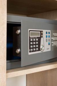 a microwave oven sitting on top of a shelf at City Hotels Rūdninkai in Vilnius