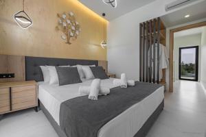 Postel nebo postele na pokoji v ubytování Tota Suites