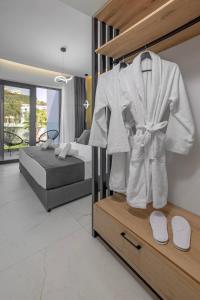 Postel nebo postele na pokoji v ubytování Tota Suites