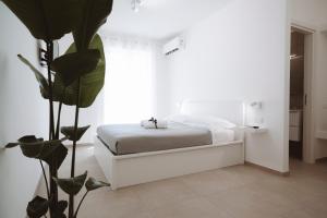 Postel nebo postele na pokoji v ubytování Gioema