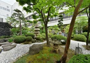 Um jardim em 戸倉上山田温泉ホテル圓山荘
