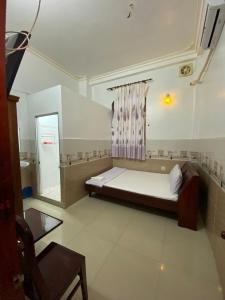 Postel nebo postele na pokoji v ubytování Thanh Tâm Hotel