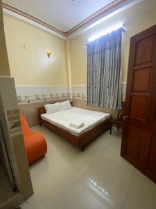 Postel nebo postele na pokoji v ubytování Thanh Tâm Hotel