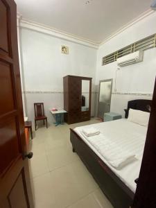 Postel nebo postele na pokoji v ubytování Thanh Tâm Hotel