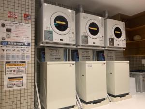 a row of machines on display in a store at KKR Hotel Kumamoto in Kumamoto