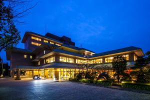 a building with a lot of windows at night at KKR Hotel Kumamoto in Kumamoto
