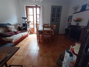 a living room with a couch and a table at Tranquil and Spacious Townhouse in Historical and Picturesque Cervera Del Maestre in Cervera del Maestre +26 photos