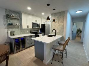 a kitchen with a sink and a counter top at Boho Island Paradise Remodel 2BR in Waikoloa Village