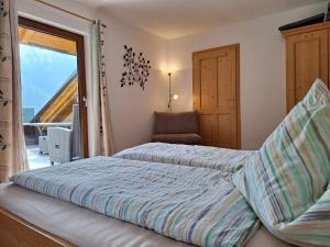 Letto o letti in una camera di Biobauernhof Poidlbauer