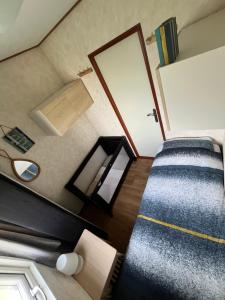 Postel nebo postele na pokoji v ubytování Chalet De Miranda