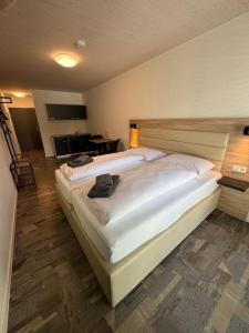 Postelja oz. postelje v sobi nastanitve Hotel Lijo, bei Basel