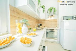 Kuchyň nebo kuchyňský kout v ubytování Baltic Apartments - Willa Carmen
