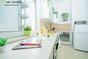 Kuchyň nebo kuchyňský kout v ubytování Baltic Apartments - Willa Carmen