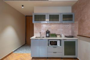 Kuchyň nebo kuchyňský kout v ubytování Boutique Hotel By One Tree + 37 fotografií