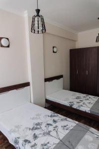 Ένα ή περισσότερα κρεβάτια σε δωμάτιο στο Kobuleti Residence Appartment
