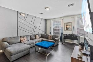 a living room with a couch and a table at 4845 Tidecrest Avenue 144 in Orlando