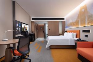 Letto o letti in una camera di Hampton by Hilton Guigang