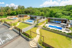an aerial view of a house with a yard at Morris Resort Tohginbow in Sakai