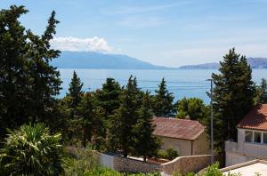 a view of the ocean from a house at Villa Vinodol *with great sea view and pool in Novi Vinodolski
