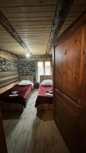 Postel nebo postele na pokoji v ubytování Pirikiti chesho