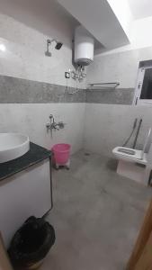 a bathroom with a sink and a toilet at SpitivalleyHomestay in Kaza