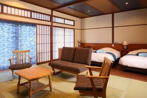 Postel nebo postele na pokoji v ubytování 筑波山江戸屋