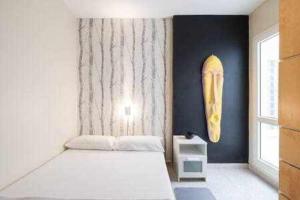 En eller flere senge i et værelse på ALBATROS 1L Tres habitaciones