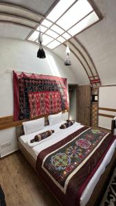 Ένα ή περισσότερα κρεβάτια σε δωμάτιο στο Eco Resort Kara Bulak