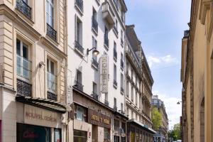 a street with buildings on a city street at H&ocirc;tel Saint Pierre in Paris