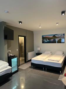 Voodi või voodid majutusasutuse Hotel Duus by Keflavik Airport toas
