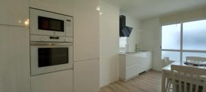 A kitchen or kitchenette at Perla del Cantábrico