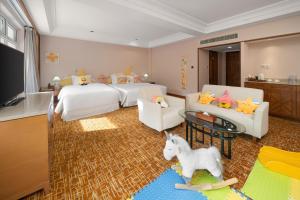 a childrens bedroom with two beds and a unicorn at Lebanshan Hotel Jiuzhai Valley in Jiuzhaigou