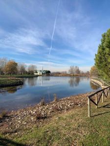 a view of a river with a bridge in the foreground at Houses and Apt in Caorle 43917 in Caorle
