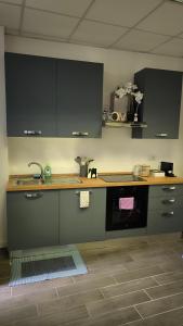 a kitchen with a sink and a counter top at Eveve's House in Parma
