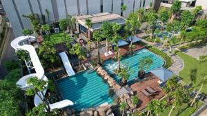 an overhead view of a pool at a resort at Padma Hotel Semarang in Semarang +45 photos