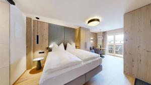 Postel nebo postele na pokoji v ubytování BUSSLEHNER Apartments