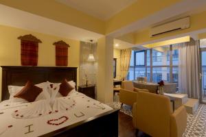 Postel nebo postele na pokoji v ubytování ARISON Hotel