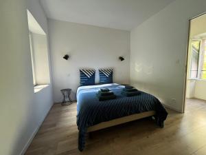 Postel nebo postele na pokoji v ubytování Petit maison du Vallon
