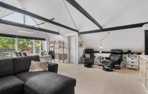 a living room with a couch and chairs in it at Awesome Home In Hemmet With Wifi in Hemmet