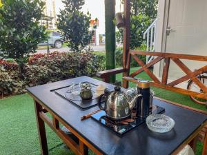 a table with a tea set on top of it at Titiwangsa Premium Villa KL by uBook in Kuala Lumpur