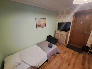 TV a/nebo společenská místnost v ubytování Paide B&B