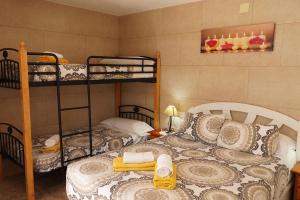 Ένα ή περισσότερα κρεβάτια σε δωμάτιο στο Cal Gasso Casa Rural con encanto en Delta del Ebro